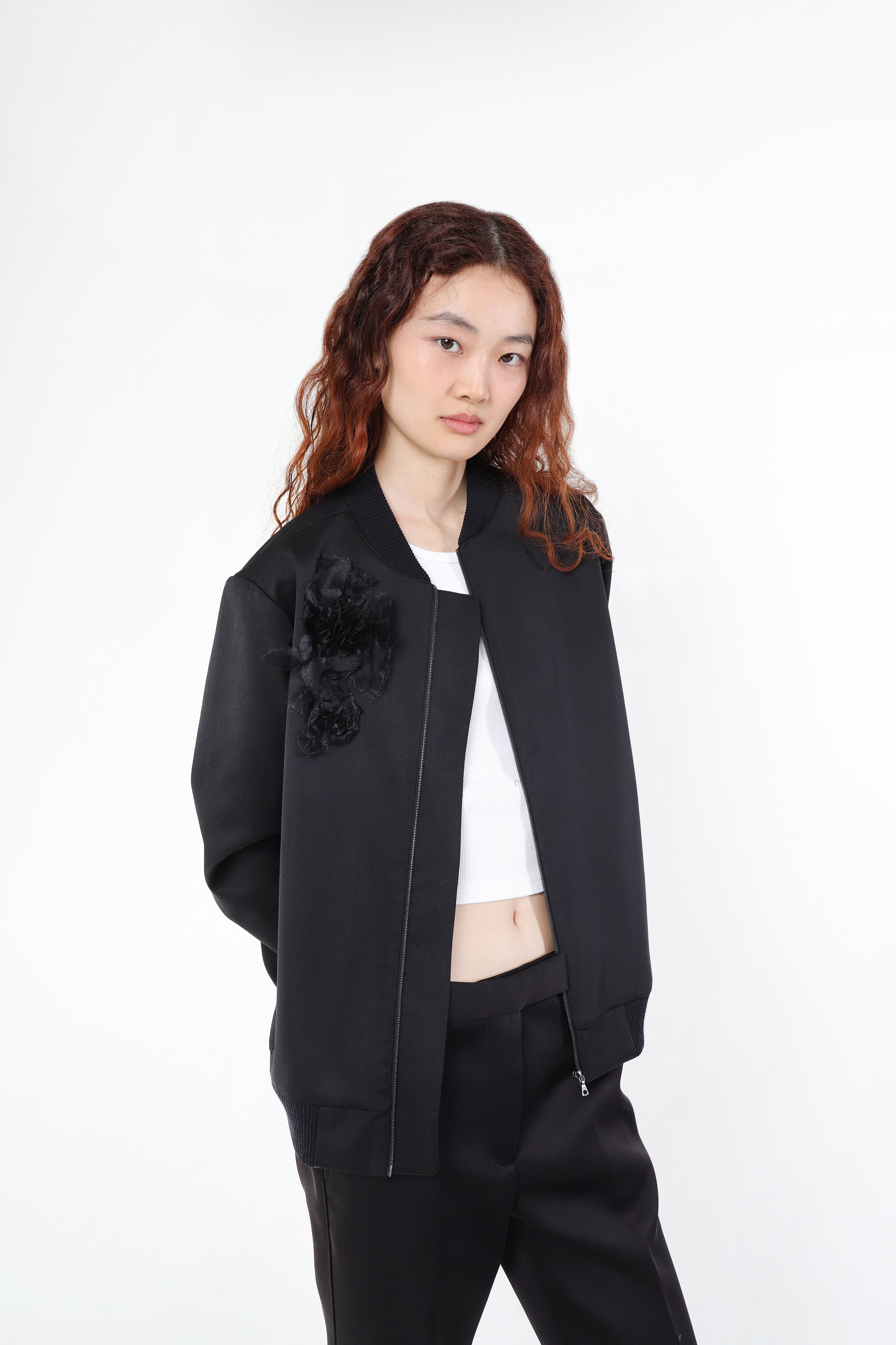 Model wearing Magnolia jacket in Black (front view)